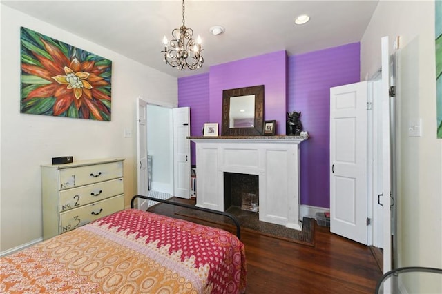 7328-30 Spruce St, New Orleans, LA 70118 - bedroom with dark wood-style floors, a chandelier, baseboards, a fireplace, and recessed lighting