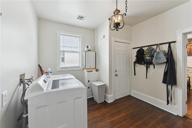 7328-30 Spruce St, New Orleans, LA 70118 - washroom featuring washing machine and clothes dryer, dark wood-type flooring, and baseboards