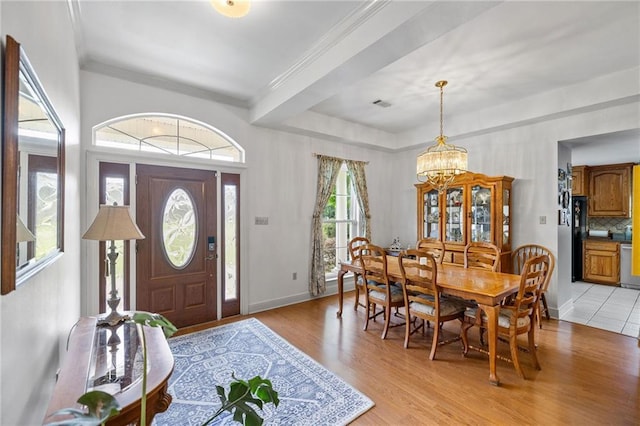 18332 Honeysuckle Dr, Ponchatoula, LA 70454 - foyer with a chandelier, light wood-type flooring, and ornamental molding