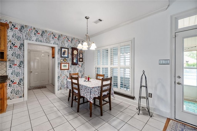 18332 Honeysuckle Dr, Ponchatoula, LA 70454 - dining room featuring baseboards, light tile patterned floors, a chandelier, crown molding, and wallpapered walls