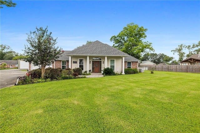 18332 Honeysuckle Dr, Ponchatoula, LA 70454 - view of front facade featuring a shingled roof and brick siding