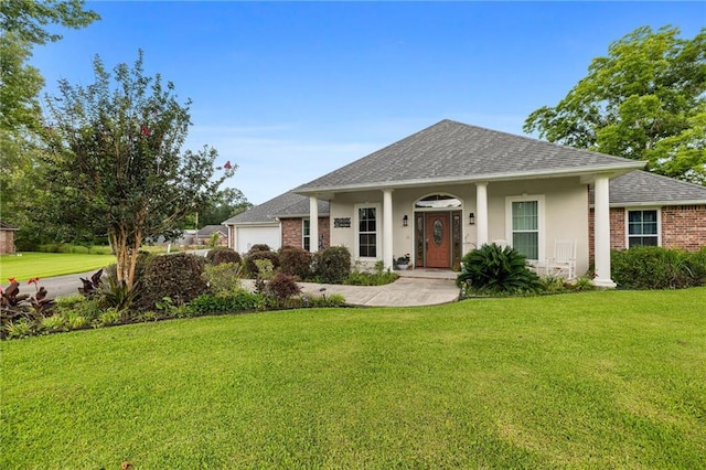 18332 Honeysuckle Dr, Ponchatoula, LA 70454 - view of front facade with a garage, a front lawn, roof with shingles, and stucco siding