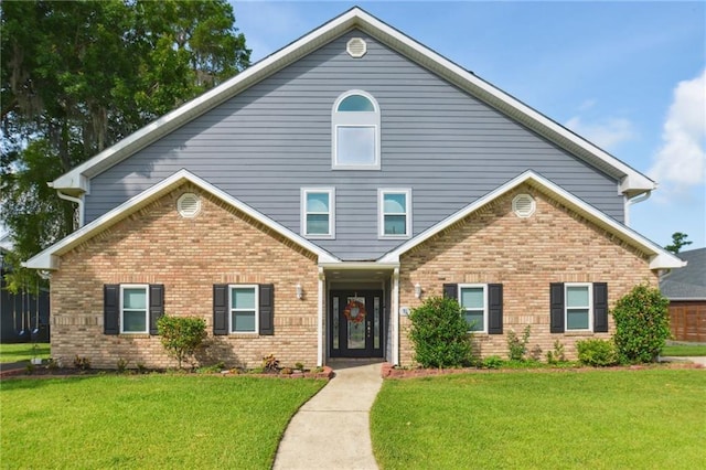 91 Rosedown Dr, Destrehan, LA 70047 - view of front facade featuring brick siding and a front yard