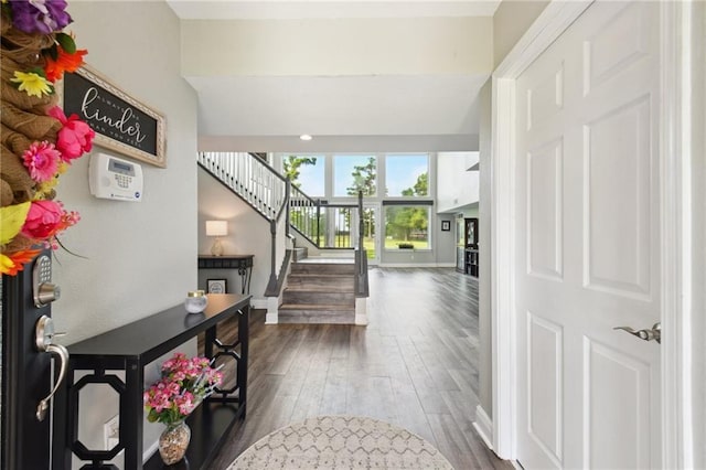 91 Rosedown Dr, Destrehan, LA 70047 - entrance foyer featuring dark wood-style flooring, stairs, and baseboards