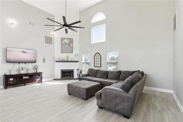 91 Rosedown Dr, Destrehan, LA 70047 - living area with a towering ceiling, baseboards, plenty of natural light, and light wood-style floors