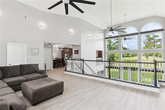 91 Rosedown Dr, Destrehan, LA 70047 - living area featuring ceiling fan, light wood-style flooring, and high vaulted ceiling