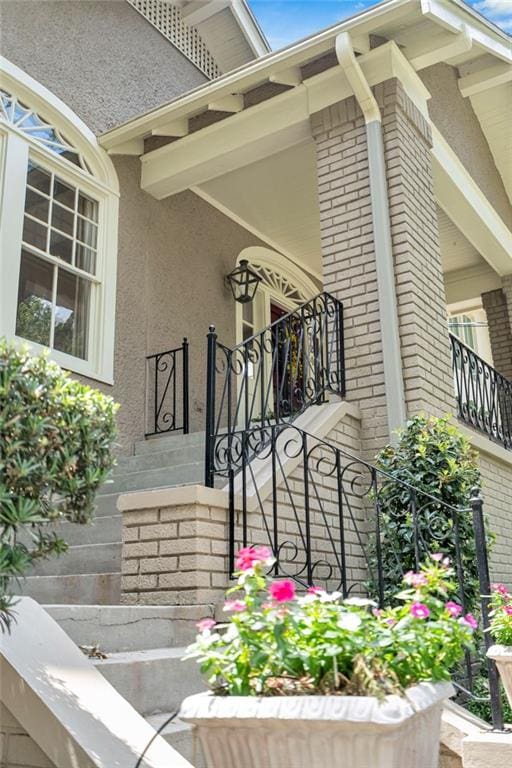 324 Fairway Dr, New Orleans, LA 70124 - view of exterior entry with brick siding and stucco siding