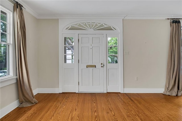 324 Fairway Dr, New Orleans, LA 70124 - entrance foyer with baseboards, light wood-style flooring, and crown molding