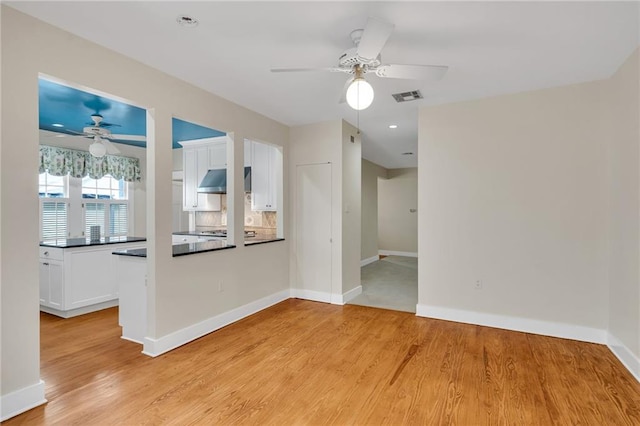 324 Fairway Dr, New Orleans, LA 70124 - unfurnished room featuring a ceiling fan, light wood-style flooring, and baseboards