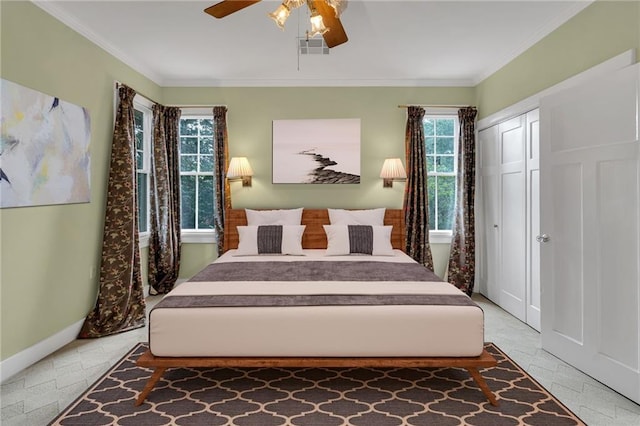 324 Fairway Dr, New Orleans, LA 70124 - bedroom featuring baseboards, ornamental molding, a ceiling fan, and a closet