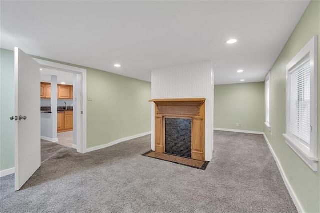 324 Fairway Dr, New Orleans, LA 70124 - unfurnished living room featuring a fireplace with flush hearth, carpet flooring, recessed lighting, and baseboards