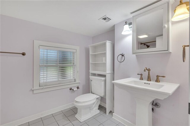 324 Fairway Dr, New Orleans, LA 70124 - bathroom with toilet, baseboards, and tile patterned flooring