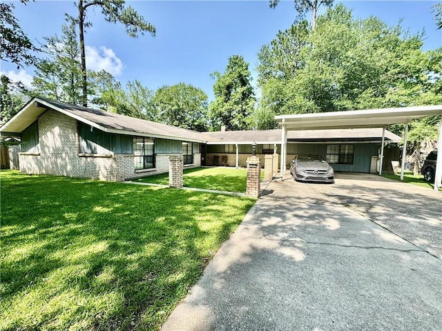 120 Whisperwood Blvd, Slidell, LA 70458 - view of front of home with driveway, a carport, a front yard, brick siding, and board and batten siding