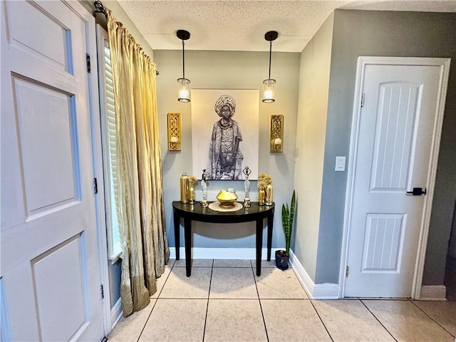 120 Whisperwood Blvd, Slidell, LA 70458 - entrance foyer with light tile patterned floors, baseboards, and a textured ceiling