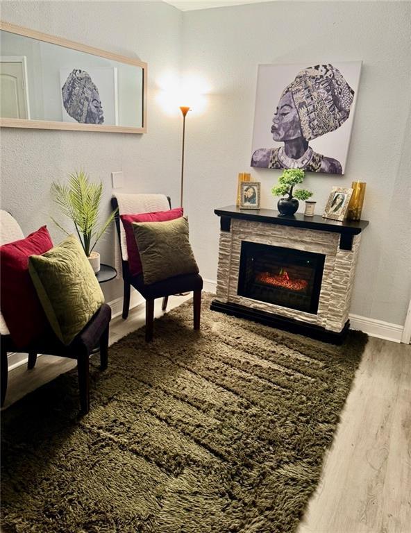 120 Whisperwood Blvd, Slidell, LA 70458 - living area with wood finished floors and a glass covered fireplace