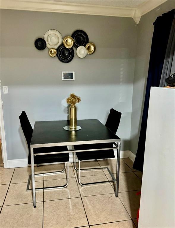 120 Whisperwood Blvd, Slidell, LA 70458 - dining area featuring ornamental molding and light tile patterned floors