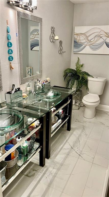 120 Whisperwood Blvd, Slidell, LA 70458 - bathroom with vanity and marble look tiles