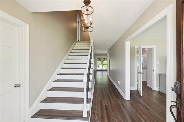2351 Ormond Blvd, Destrehan, LA 70047 - staircase with wood finished floors, baseboards, and a chandelier