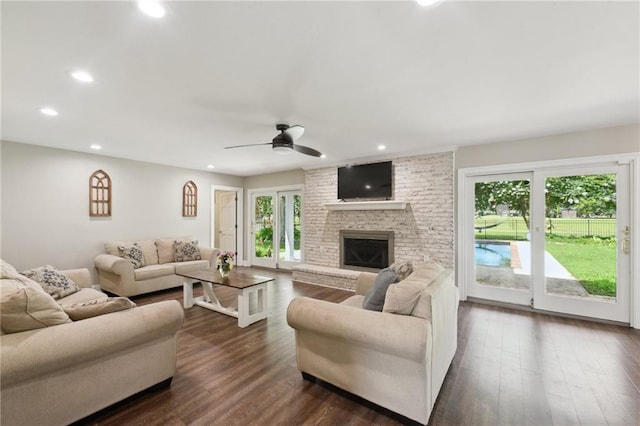 2351 Ormond Blvd, Destrehan, LA 70047 - living room with recessed lighting, a ceiling fan, a brick fireplace, and dark wood-style floors