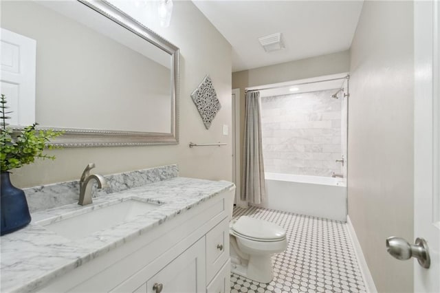 2351 Ormond Blvd, Destrehan, LA 70047 - full bath with vanity, toilet, shower / bathtub combination with curtain, tile patterned floors, and baseboards