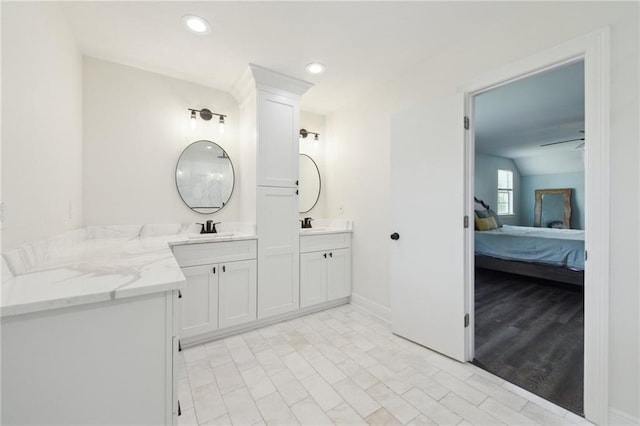2351 Ormond Blvd, Destrehan, LA 70047 - ensuite bathroom featuring double vanity, baseboards, and recessed lighting
