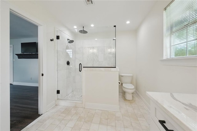 2351 Ormond Blvd, Destrehan, LA 70047 - full bath with baseboards, a stall shower, toilet, vanity, and recessed lighting