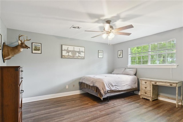 2351 Ormond Blvd, Destrehan, LA 70047 - bedroom with dark wood finished floors, baseboards, and a ceiling fan