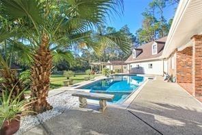 115 Devereux Dr, Slidell, LA 70461 - outdoor pool featuring a patio area