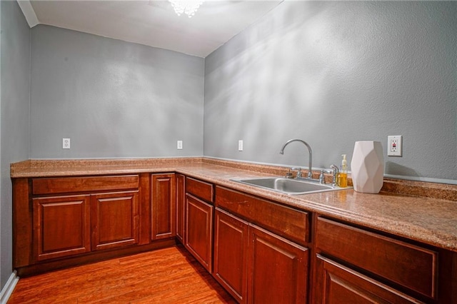 115 Devereux Dr, Slidell, LA 70461 - kitchen with a sink, light wood finished floors, and light countertops