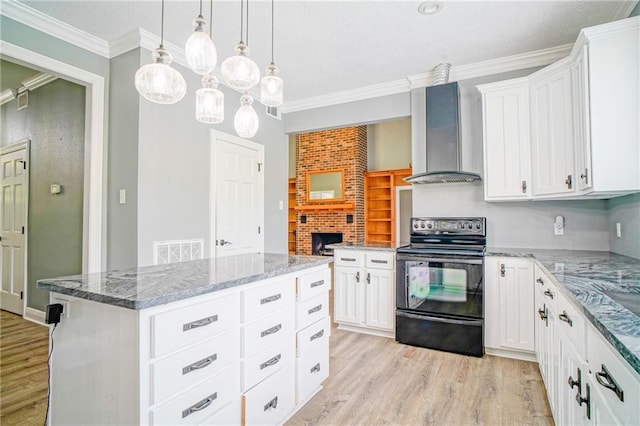 115 Devereux Dr, Slidell, LA 70461 - kitchen featuring black electric range, wall chimney exhaust hood, light wood-style floors, crown molding, and white cabinets