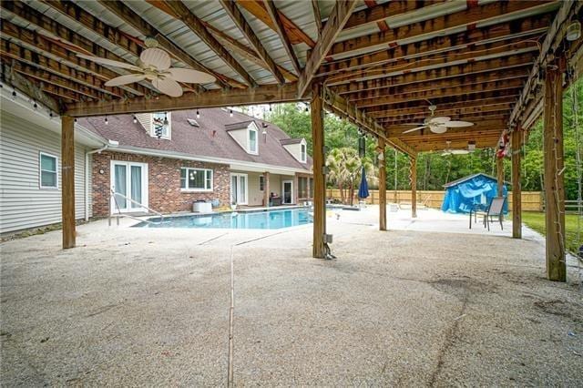115 Devereux Dr, Slidell, LA 70461 - view of pool with a ceiling fan, a patio, and a storage shed