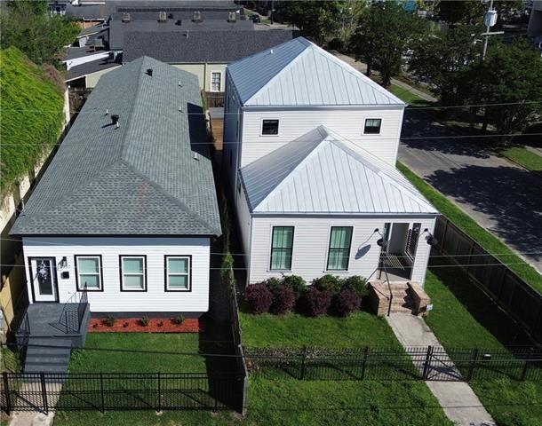 3507 Danneel St, New Orleans, LA 70115 - view of front of property featuring a fenced front yard, a metal roof, and covered porch
