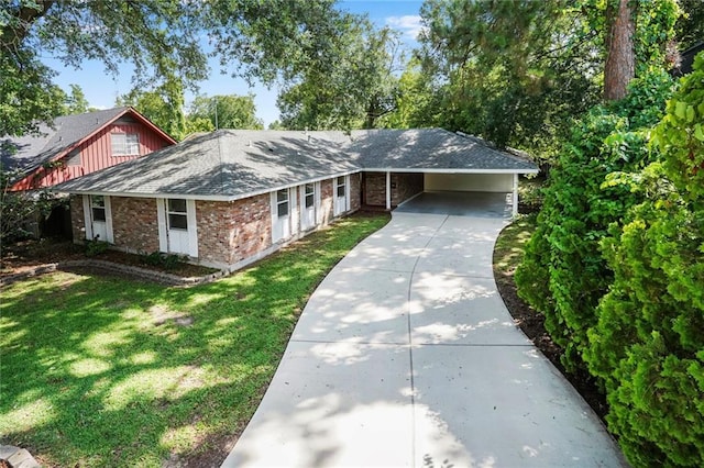 9509 Robin Ln, River Ridge, LA 70123 - view of front of property featuring brick siding, a front yard, concrete driveway, roof with shingles, and an attached carport