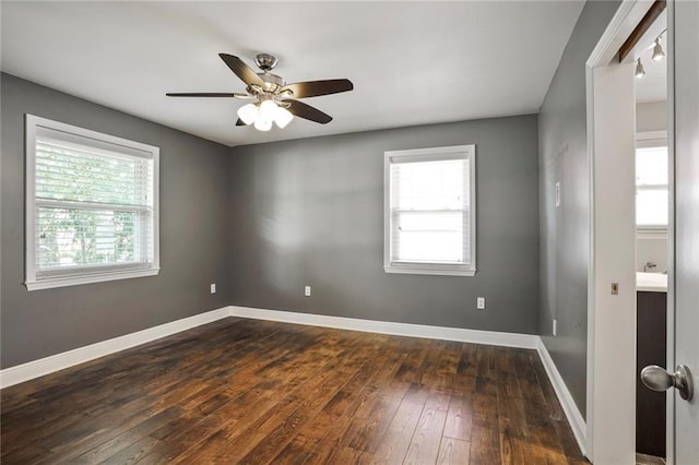 9509 Robin Ln, River Ridge, LA 70123 - empty room featuring dark wood finished floors, ceiling fan, and baseboards