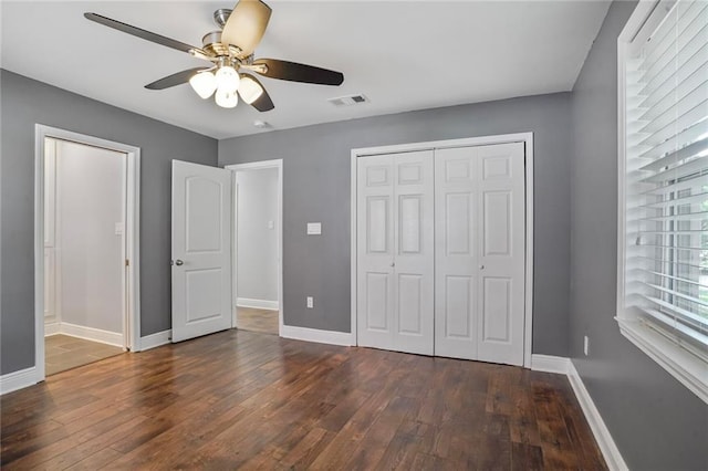 9509 Robin Ln, River Ridge, LA 70123 - unfurnished bedroom featuring dark wood finished floors, baseboards, a closet, and ceiling fan