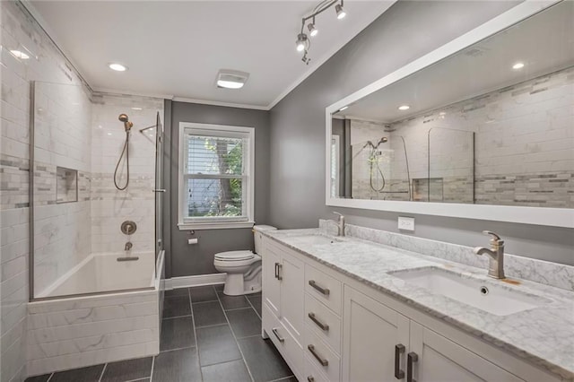 9509 Robin Ln, River Ridge, LA 70123 - full bath featuring tiled shower / bath, tile patterned flooring, double vanity, toilet, and baseboards