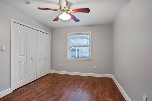 9509 Robin Ln, River Ridge, LA 70123 - unfurnished bedroom with dark wood-style floors, baseboards, a closet, and ceiling fan