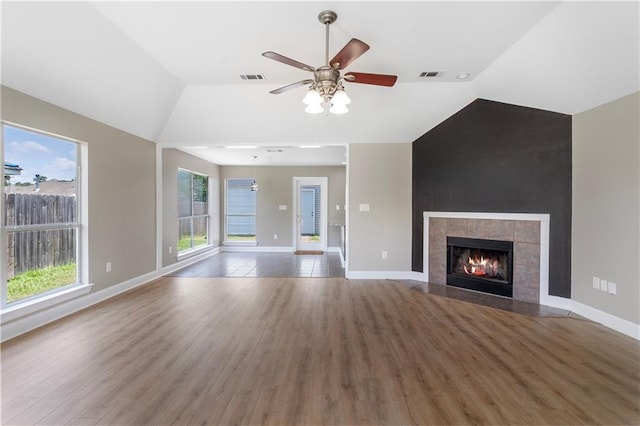 70382 10th St, Covington, LA 70433 - unfurnished living room featuring vaulted ceiling, wood finished floors, a ceiling fan, baseboards, and a fireplace