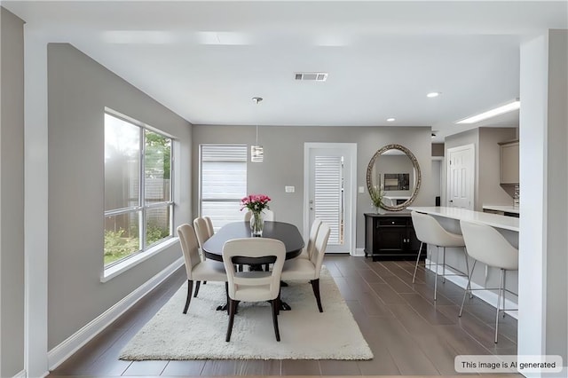 70382 10th St, Covington, LA 70433 - dining space with baseboards, recessed lighting, and dark wood finished floors