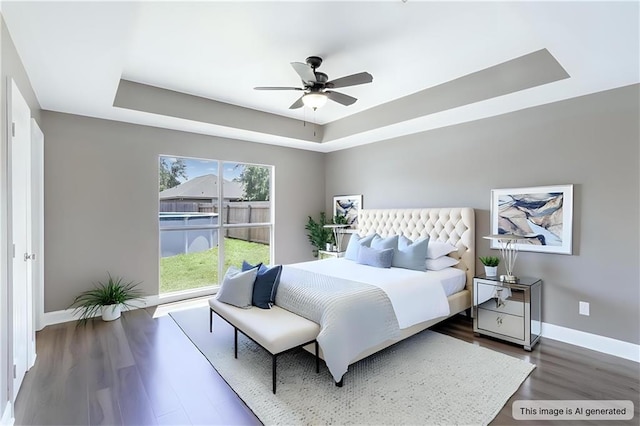 70382 10th St, Covington, LA 70433 - bedroom featuring a raised ceiling, baseboards, dark wood-type flooring, and a ceiling fan