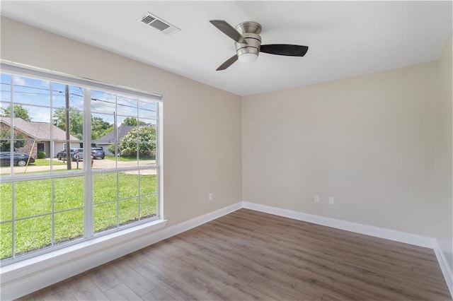 70382 10th St, Covington, LA 70433 - empty room with baseboards, wood finished floors, and a ceiling fan