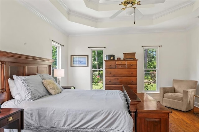 1833 Octavia Dr, Mandeville, LA 70448 - bedroom featuring wood finished floors, ornamental molding, a raised ceiling, and ceiling fan