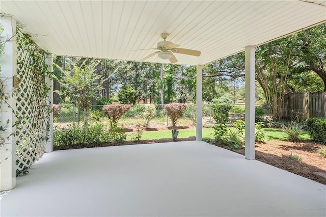 1833 Octavia Dr, Mandeville, LA 70448 - fenced backyard featuring a ceiling fan and a patio
