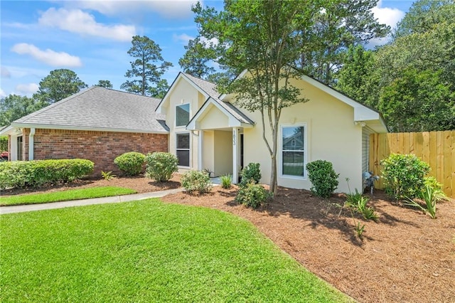 1833 Octavia Dr, Mandeville, LA 70448 - traditional home with roof with shingles, stucco siding, and brick siding