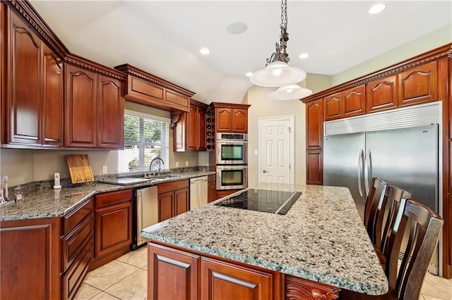 209 Partridge Rd, Slidell, LA 70461 - kitchen with appliances with stainless steel finishes, a center island, a sink, light stone countertops, and hanging light fixtures