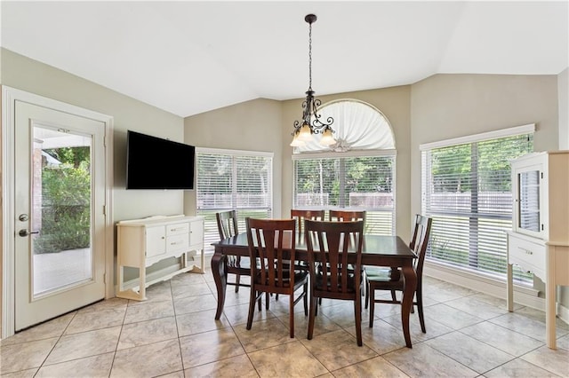 209 Partridge Rd, Slidell, LA 70461 - dining area with a chandelier, vaulted ceiling, healthy amount of natural light, and light tile patterned floors