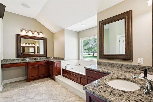 209 Partridge Rd, Slidell, LA 70461 - full bathroom with vaulted ceiling, two vanities, and a garden tub