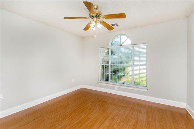 413 Moonraker Dr, Slidell, LA 70458 - empty room featuring wood finished floors, baseboards, and a ceiling fan