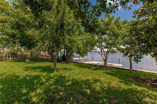 413 Moonraker Dr, Slidell, LA 70458 - view of yard with a dock and a water view