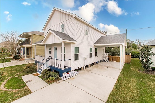5 Leeward Ct, New Orleans, LA 70131 - view of front of home featuring board and batten siding, a porch, roof with shingles, a front yard, and concrete driveway